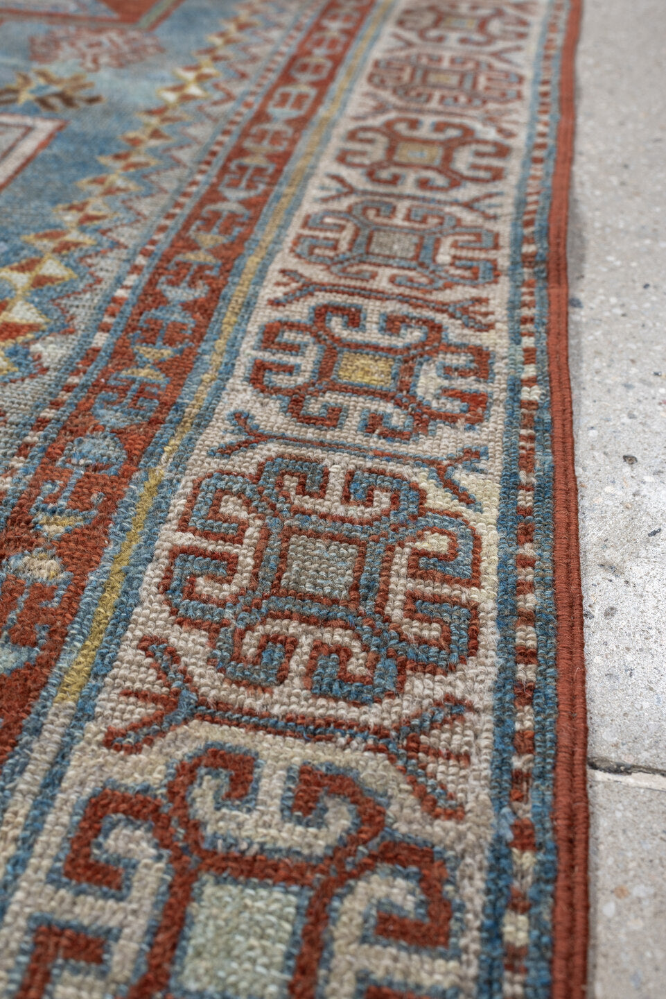 3' x 4' one-of-a-kind handmade antique Caucasian small size rug. Color palette: ivory, sky blue, rust, terra cotta, camel