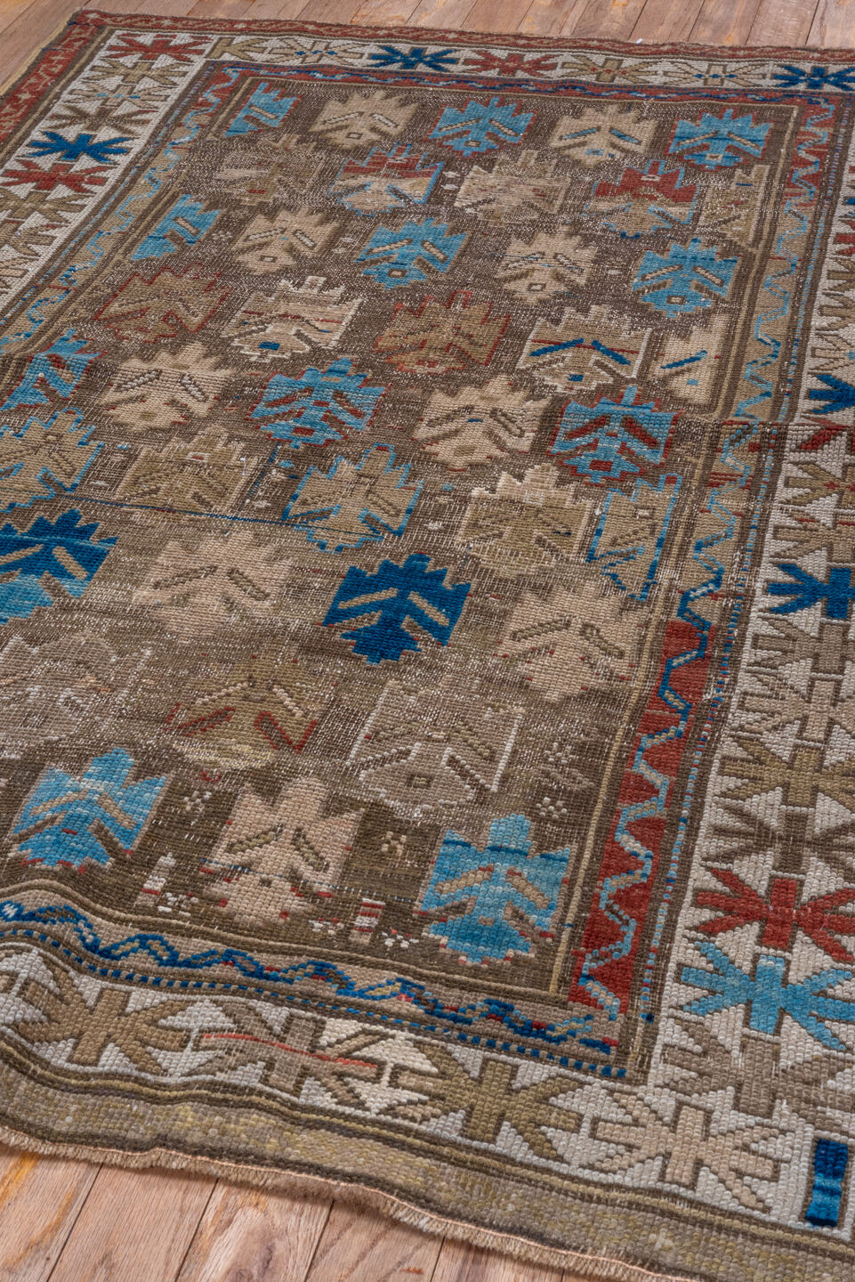 3' x 4' one-of-a-kind handmade vintage Caucasian small size rug. Color palette: blue, brown, gray, red