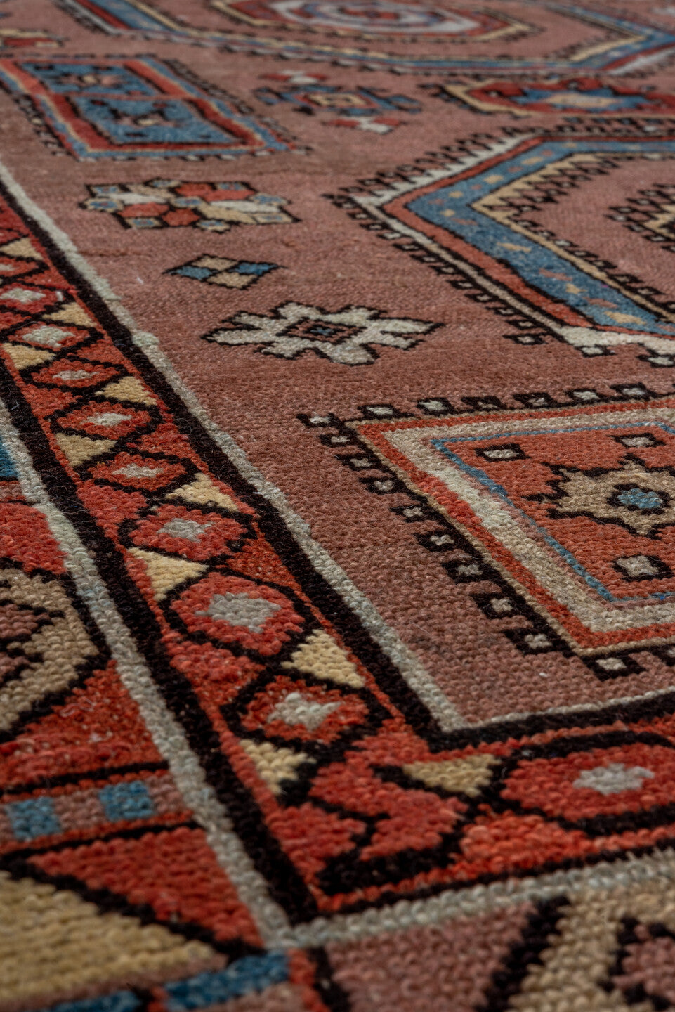 3' x 5' one-of-a-kind handmade antique Caucasian small size rug. Color palette: rose, ivory, sky_blue, rust, slate_blue