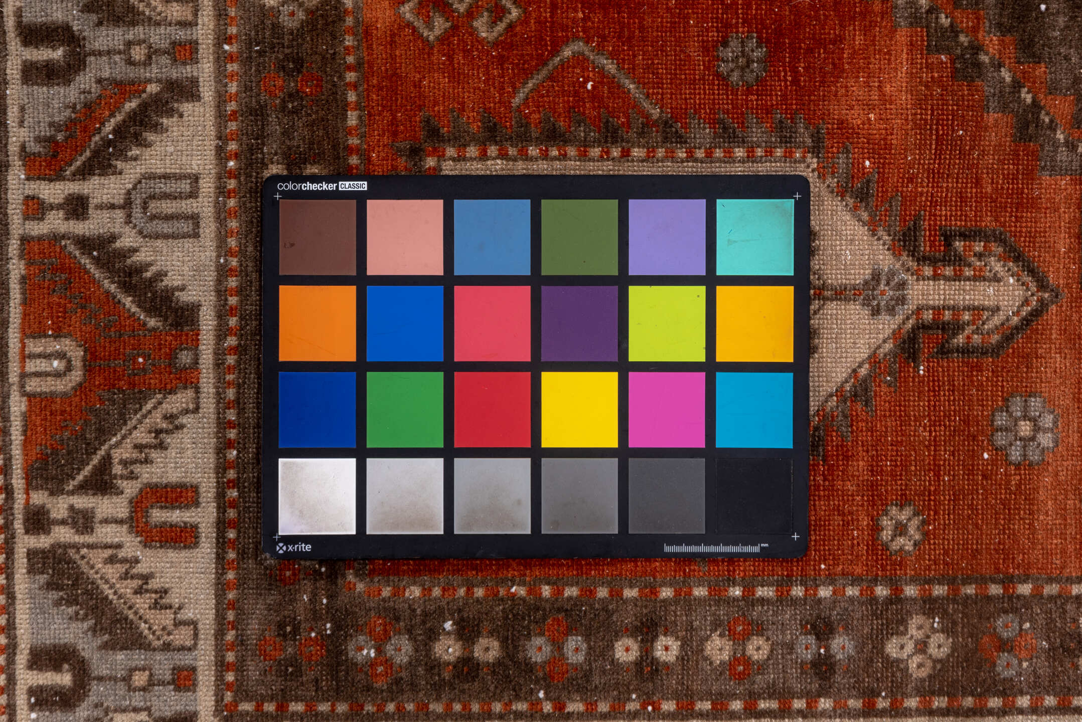 4' x 7' one-of-a-kind handmade vintage Caucasian rug. Color palette: brown, gray, light gray, off-white, pink, red