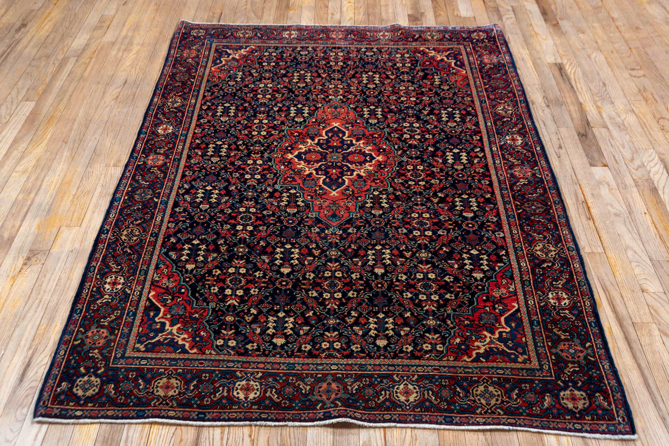 4' x 6' one-of-a-kind handmade antique Meighan small size rug. Color palette: navy, rust, ivory, crimson, slate, coral, blue