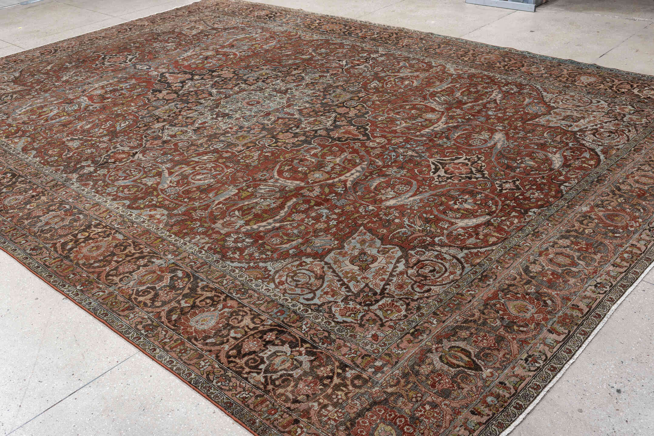 10' x 15' one-of-a-kind handmade antique Baktiary oversize rug. Color palette: terracotta, ivory, charcoal, sky blue, taupe