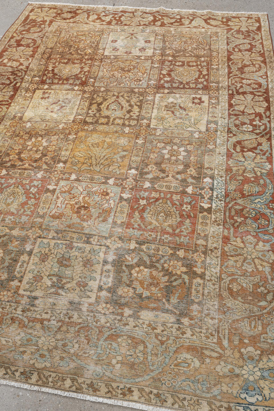 4' x 6' one-of-a-kind handmade antique Baktiary small size rug. Color palette: terracotta, ivory, pale blue, taupe, camel
