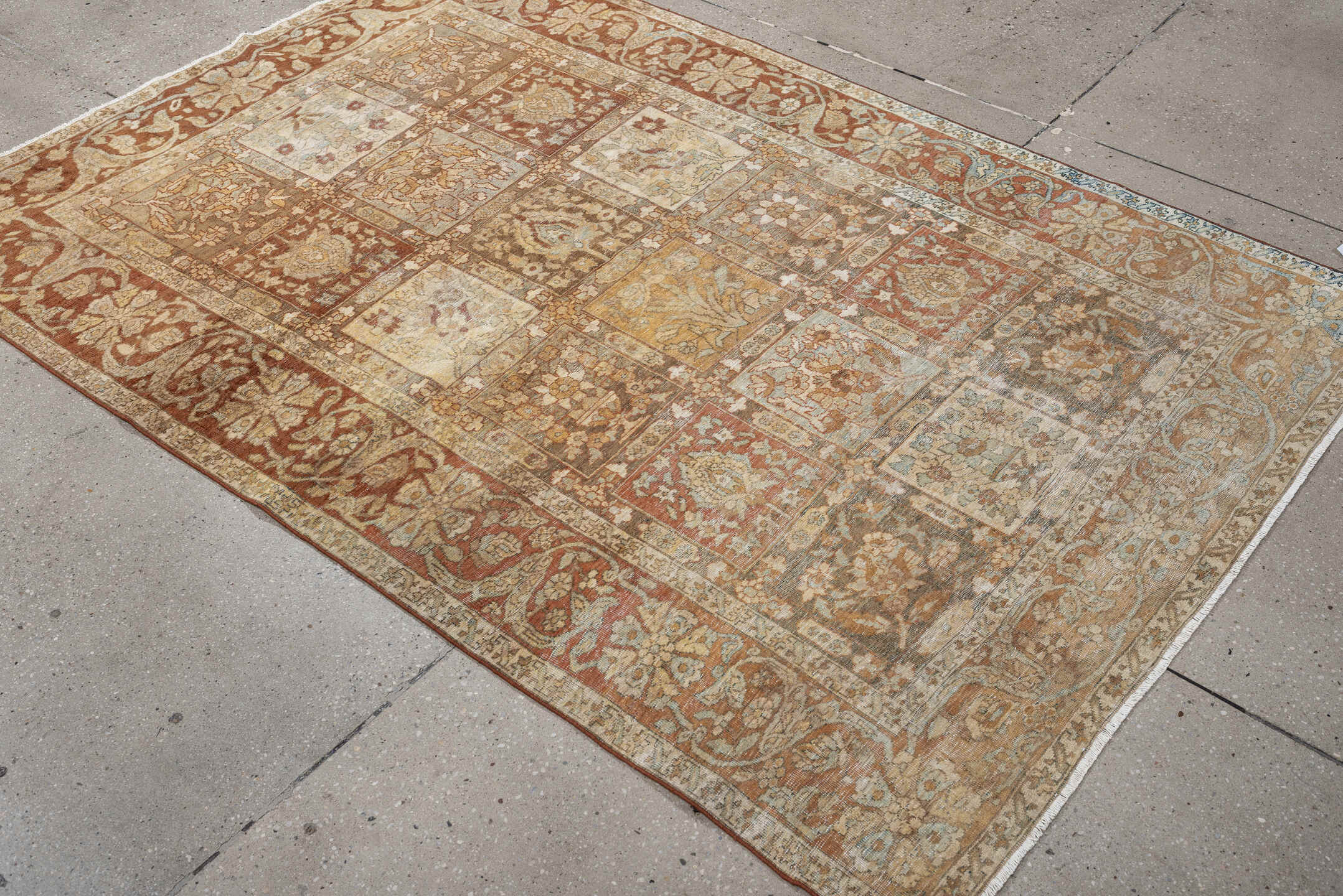 4' x 6' one-of-a-kind handmade antique Baktiary small size rug. Color palette: terracotta, ivory, pale blue, taupe, camel