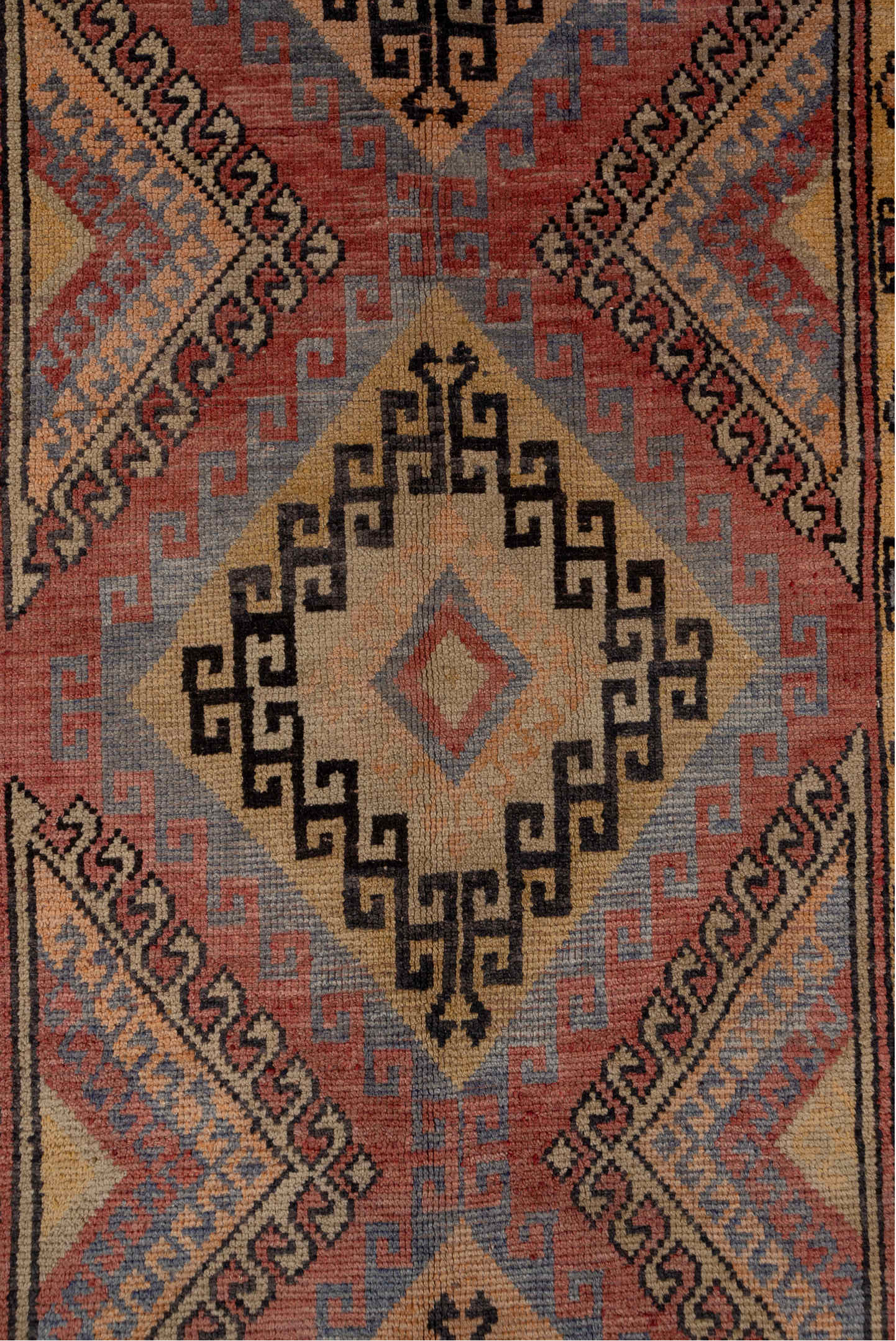 4' x 10' one-of-a-kind handmade vintage Oushak runner rug. Color palette: black, brown, gray, red