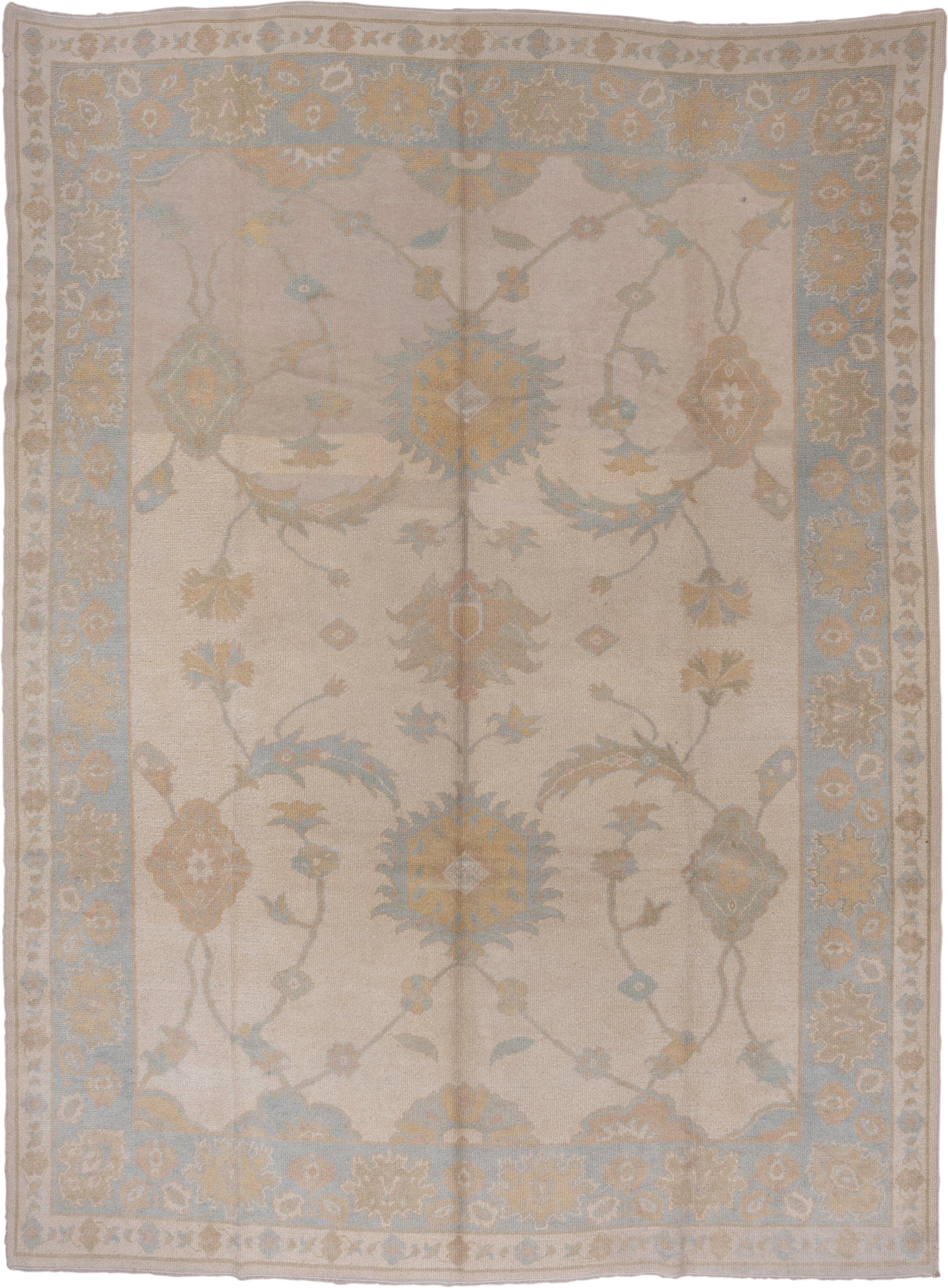 9' x 12' one-of-a-kind handmade vintage Oushak large size rug. Color palette: ivory, pale blue, taupe, gold, beige, sage