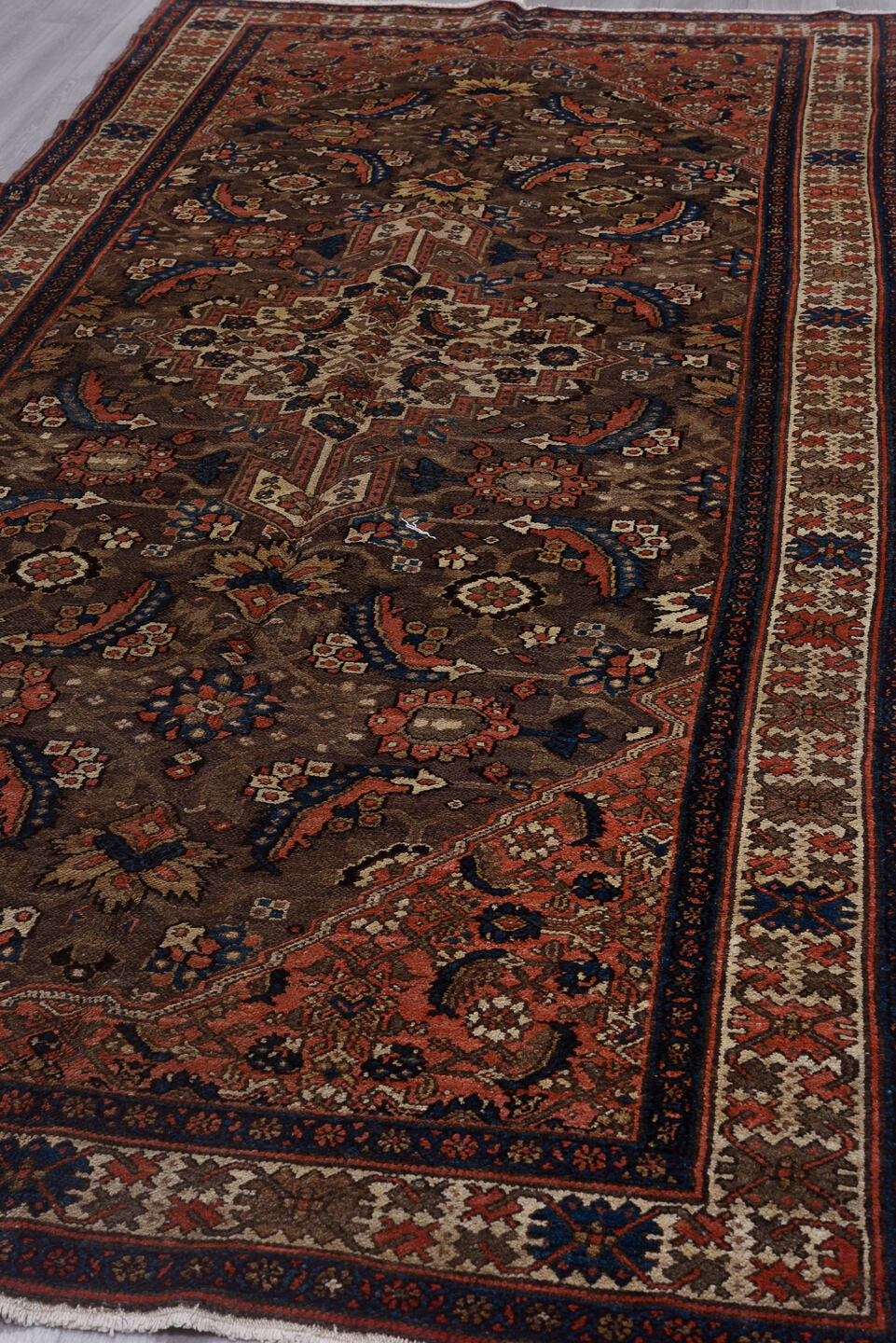 5' x 11' one-of-a-kind handmade vintage Malayer rug. Color palette: brown, ivory, rust, indigo, blue, coral, taupe