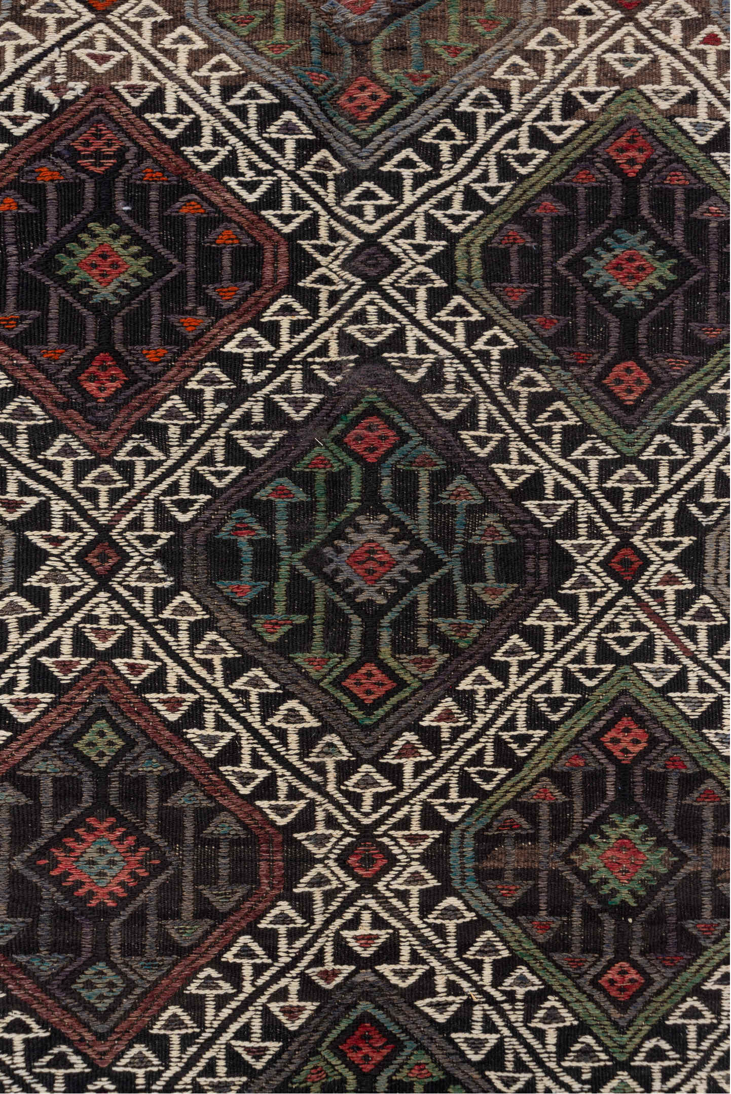 4' x 8' one-of-a-kind handmade vintage Jijim rug. Color palette: charcoal, ivory, rust, olive, taupe, rose, slate, gray