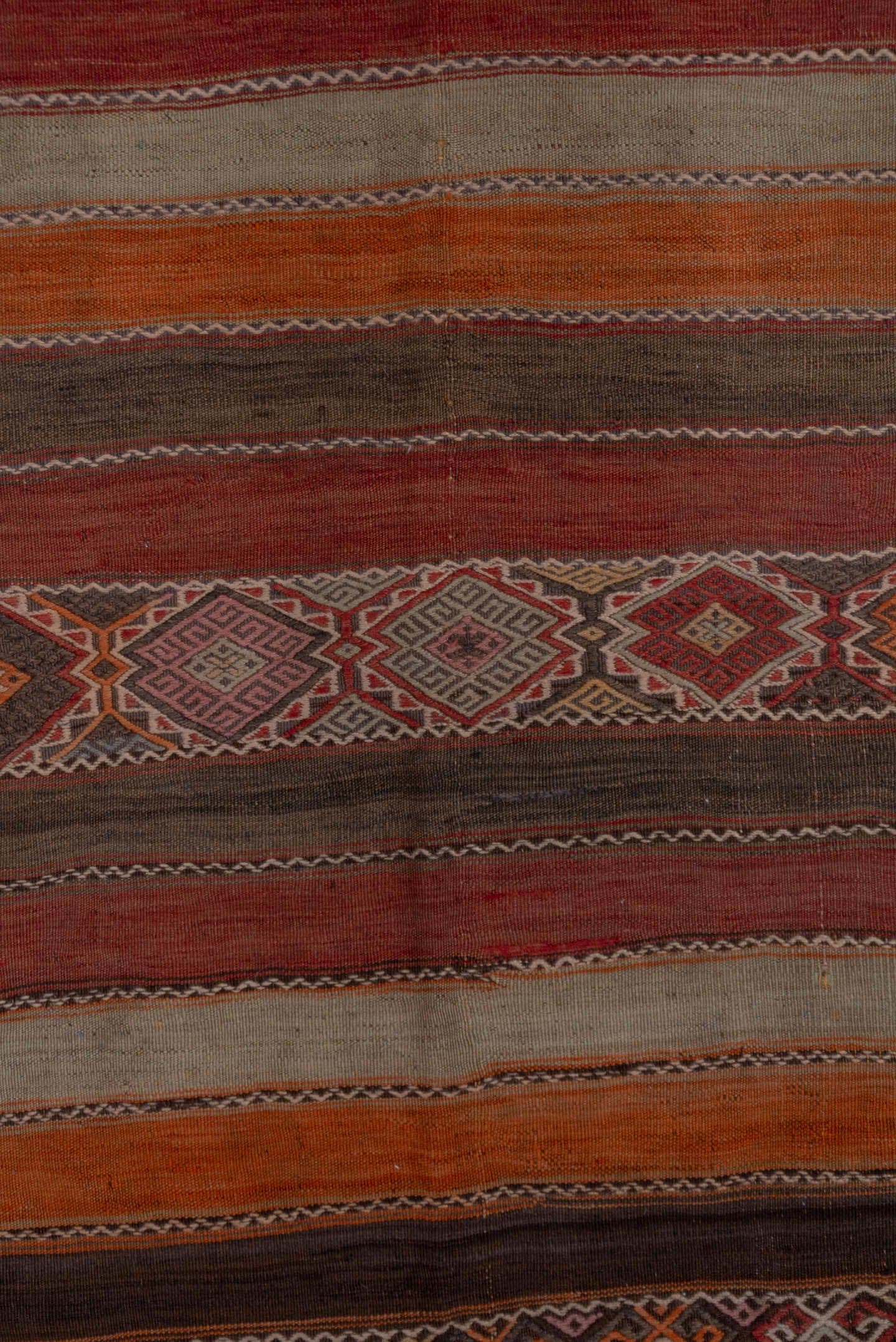 4' x 10' one-of-a-kind handmade vintage Jijim runner rug. Color palette: rust, rose, taupe, brown, charcoal, terracotta