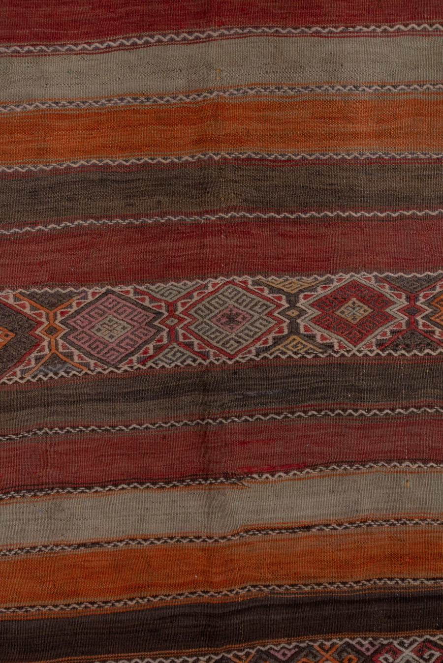 4' x 10' one-of-a-kind handmade vintage Jijim runner rug. Color palette: rust, rose, taupe, brown, charcoal, terracotta