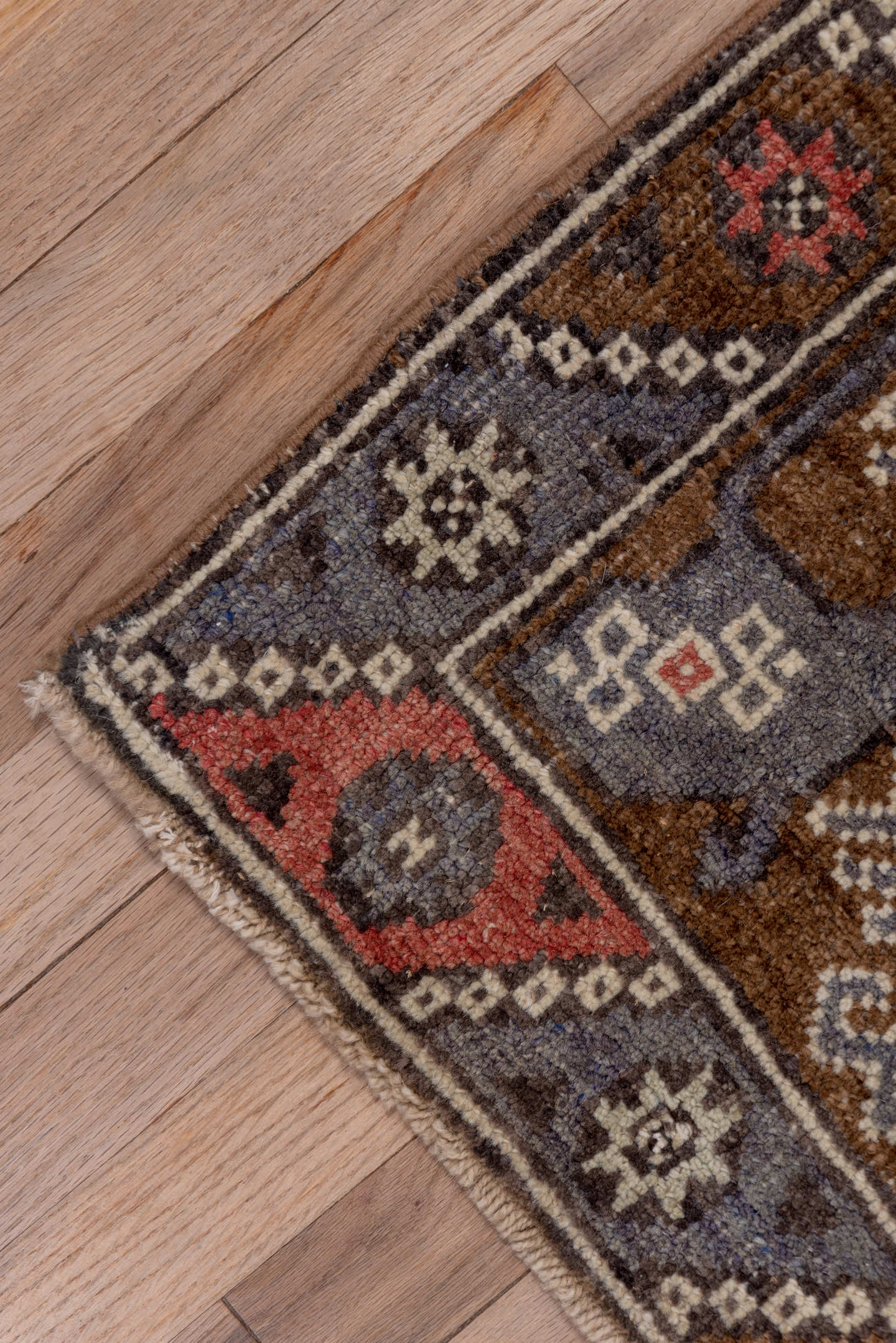 4' x 8' one-of-a-kind handmade antique Konya runner rug. Color palette: brown, coral, ivory, indigo, rust, taupe, slate