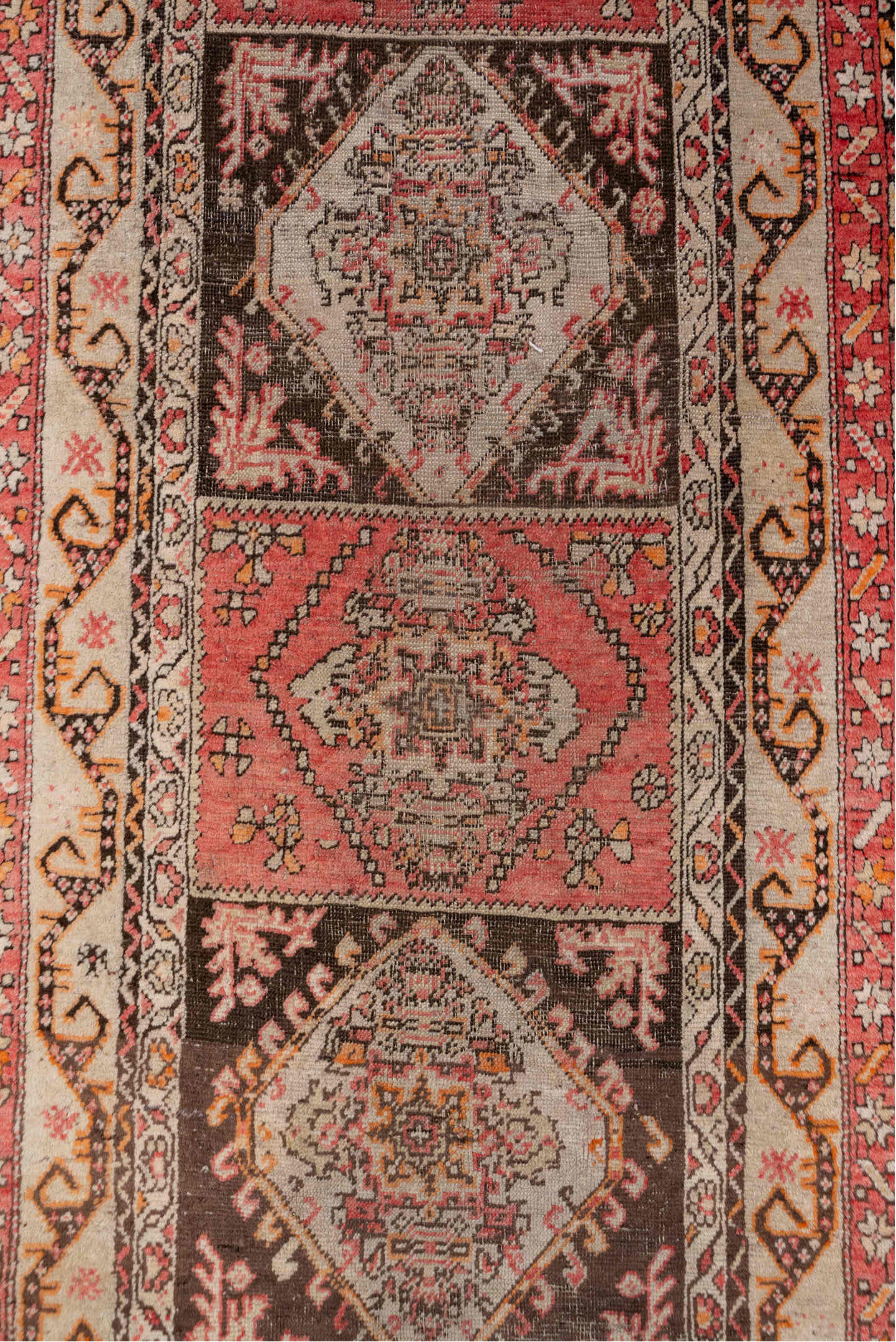 3' x 10' one-of-a-kind handmade vintage Sivas runner rug. Color palette: brown, gray, pink