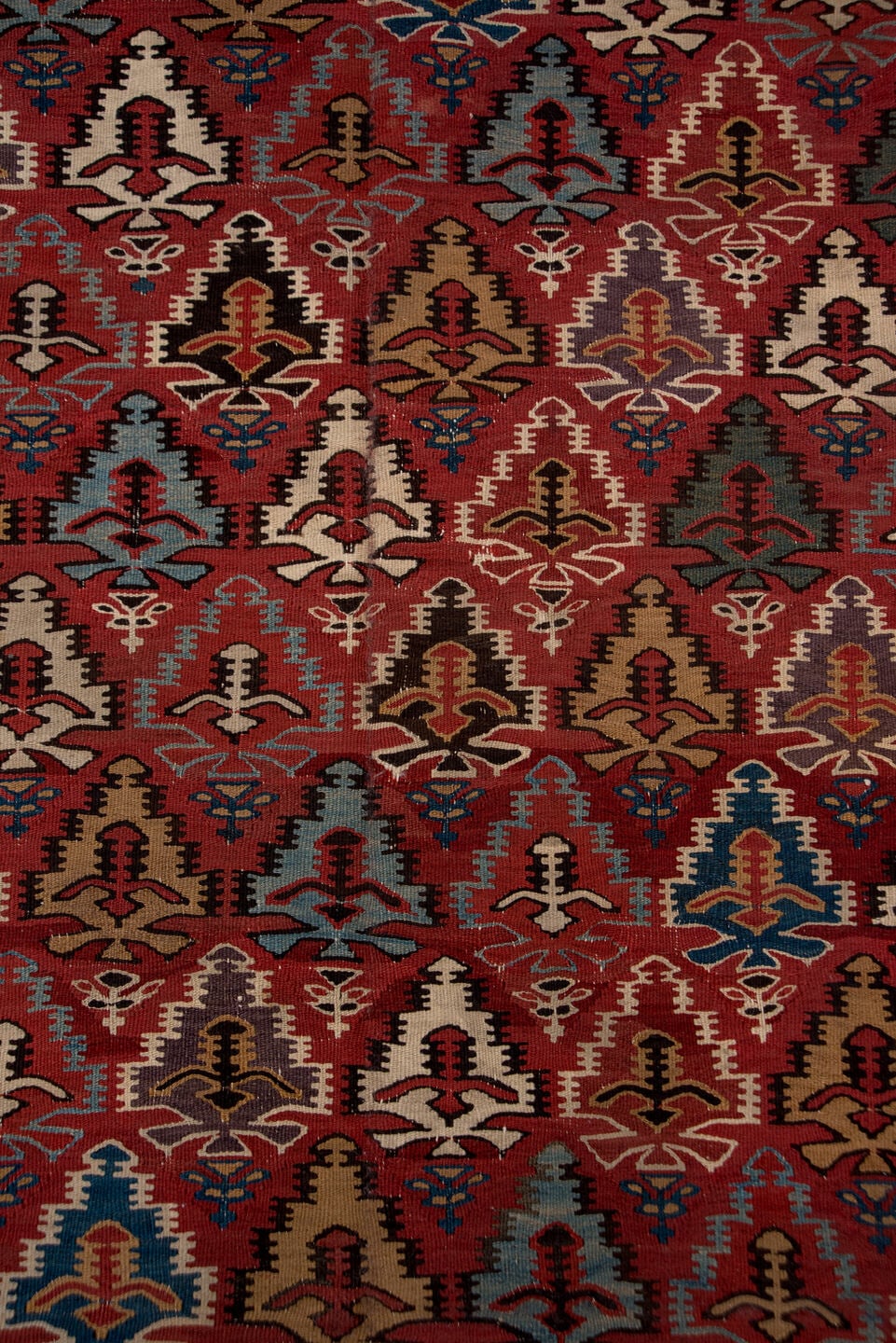 5' x 13' one-of-a-kind handmade antique Kilim rug. Color palette: rust, ivory, indigo, camel, charcoal, sky blue, burgundy
