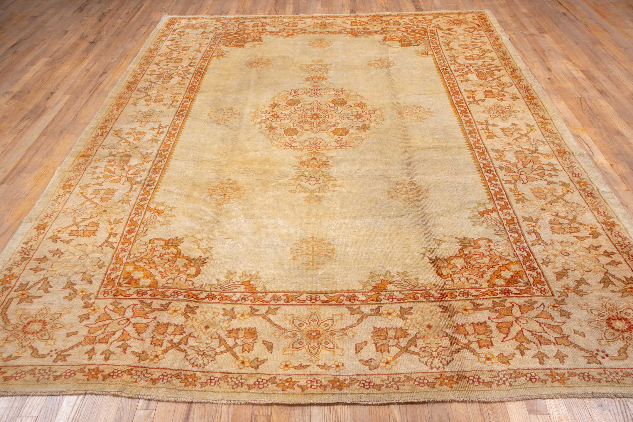 8' x 10' one-of-a-kind handmade antique Oushak large size rug. Color palette: ivory, apricot, sand, peach, camel, gold