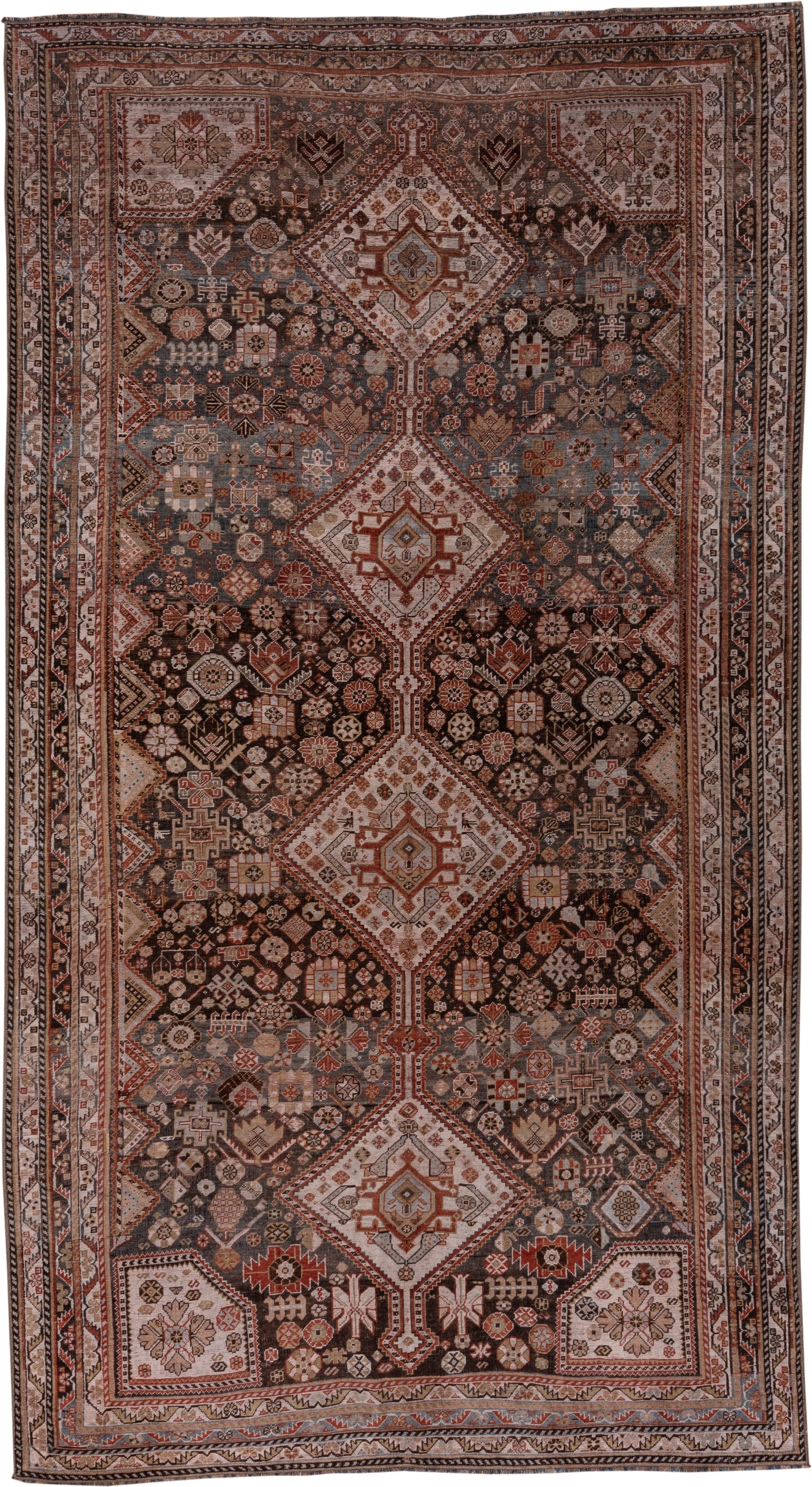 5' x 10' one-of-a-kind handmade antique Qashqai medium size rug. Color palette: ivory, charcoal, rust, slate, taupe, camel