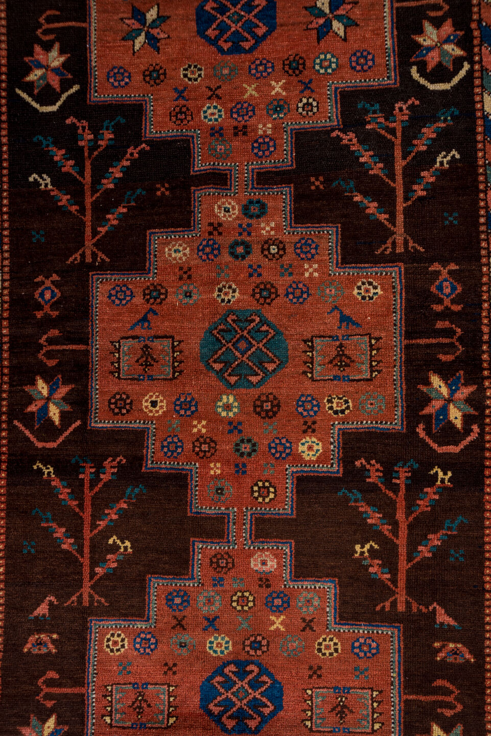 4' x 11' one-of-a-kind handmade antique Malayer runner rug. Color palette: brown, rust, ivory, navy, terra cotta, indigo