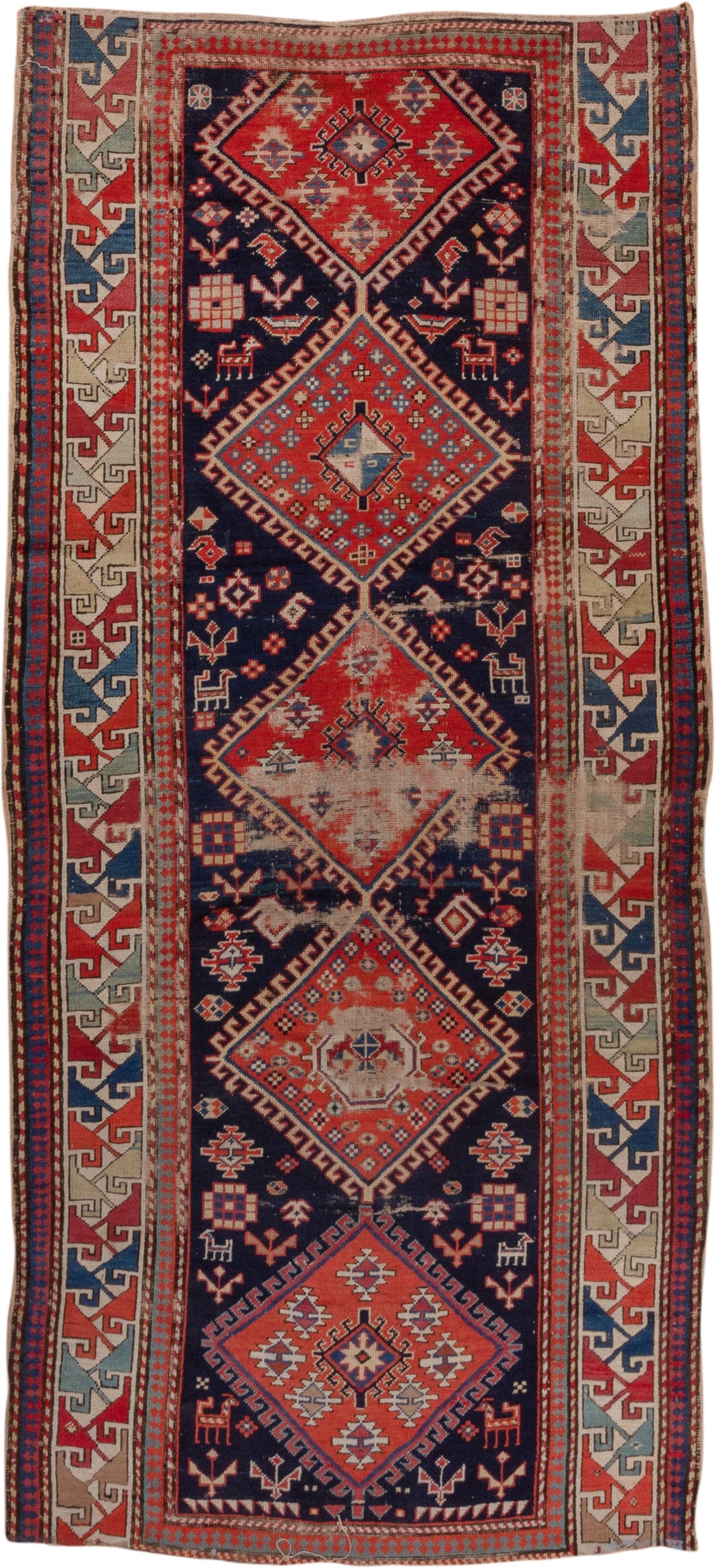 4' x 9' one-of-a-kind handmade vintage Shirvan runner rug. Color palette: navy, rust, ivory, sky blue, camel, red, slate