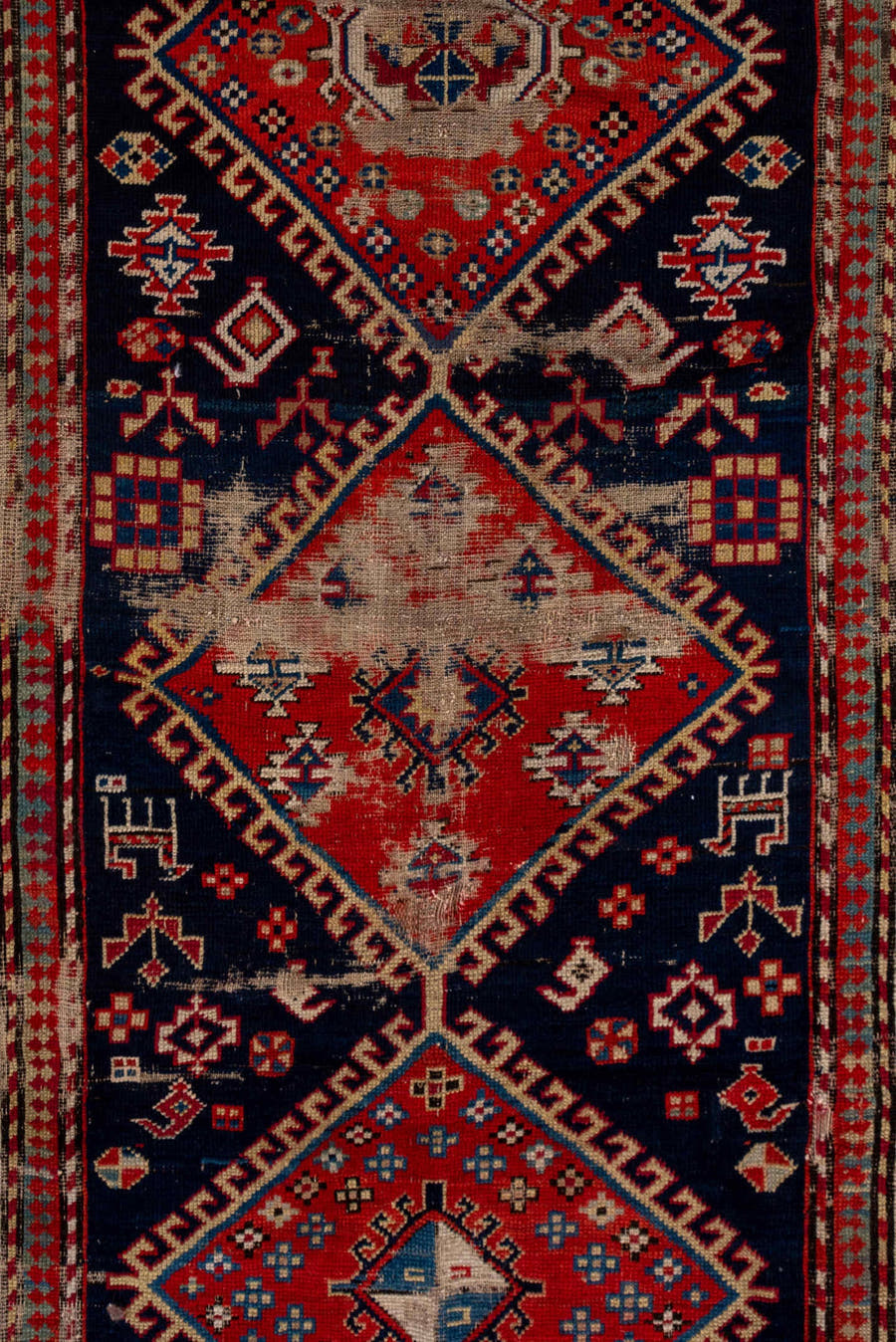 4' x 9' one-of-a-kind handmade vintage Shirvan runner rug. Color palette: navy, rust, ivory, sky blue, camel, red, slate
