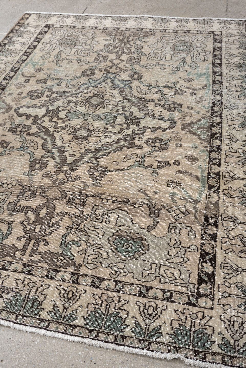 5' x 6' one-of-a-kind handmade vintage Baktiary rug. Color palette: ivory, charcoal, taupe, pale aqua, sage, beige, black