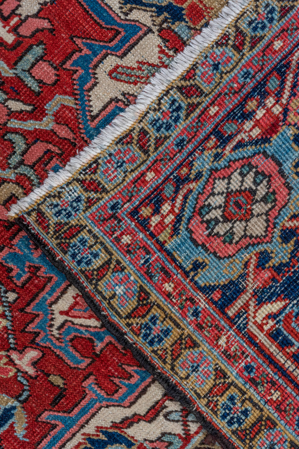7' x 10' one-of-a-kind handmade antique Heriz large size rug. Color palette: red, navy, ivory, sky blue, rose, burgundy