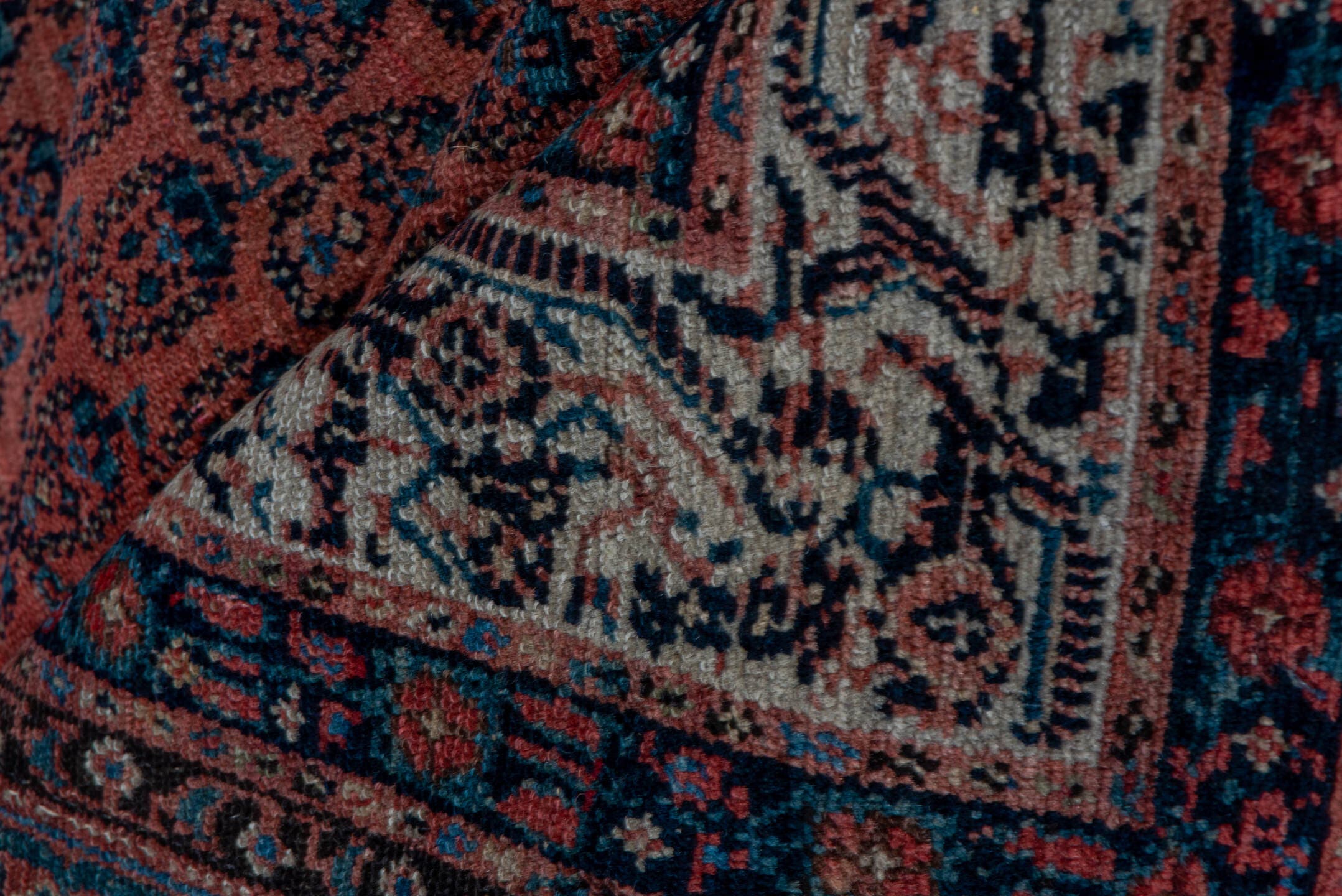 7' x 15' one-of-a-kind handmade antique Saraband rug. Color palette: rust, navy, ivory, terra cotta, charcoal, camel