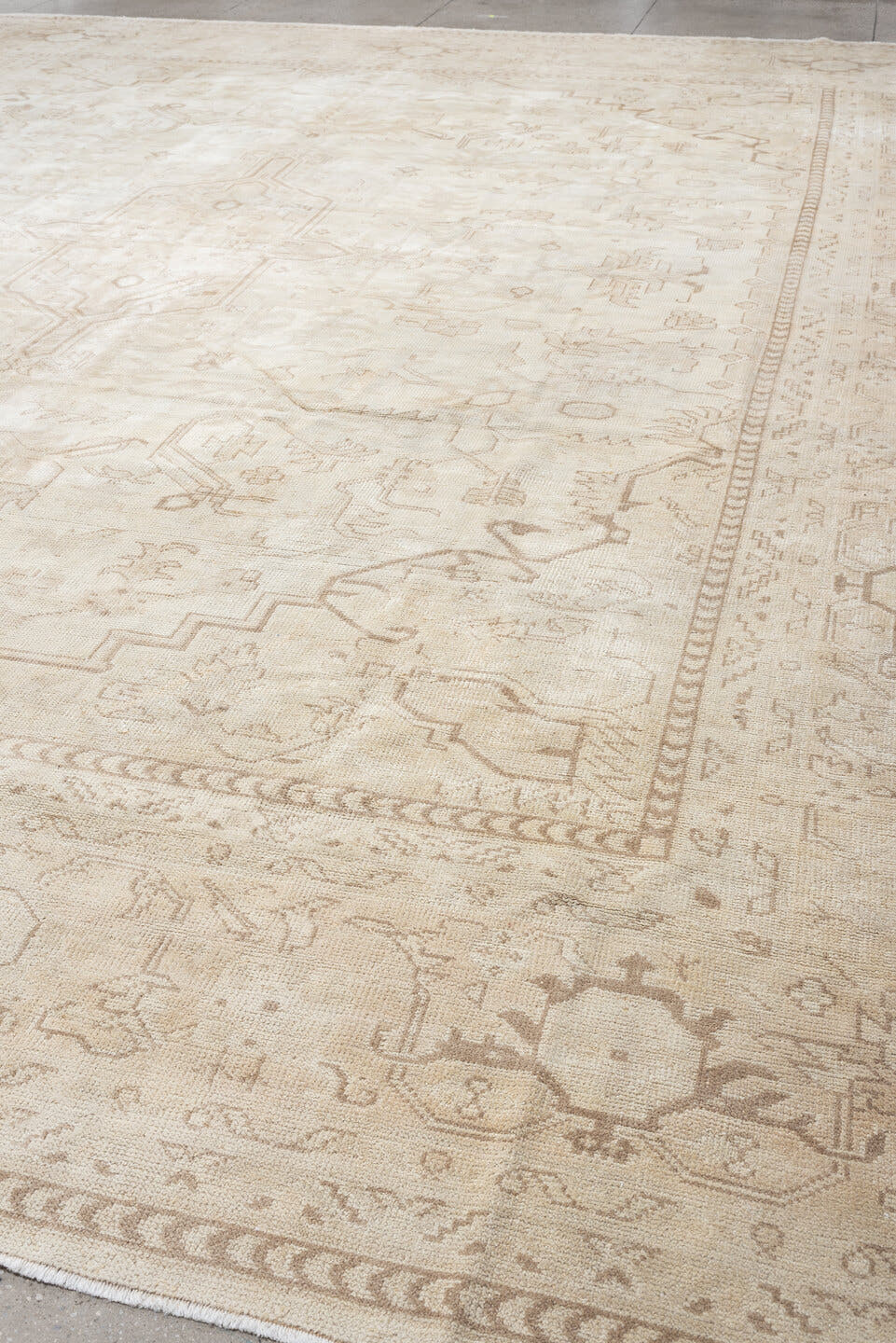 14' x 17' one-of-a-kind handmade antique Oushak oversize rug. Color palette: ivory, taupe, camel, brown, pale blue, beige