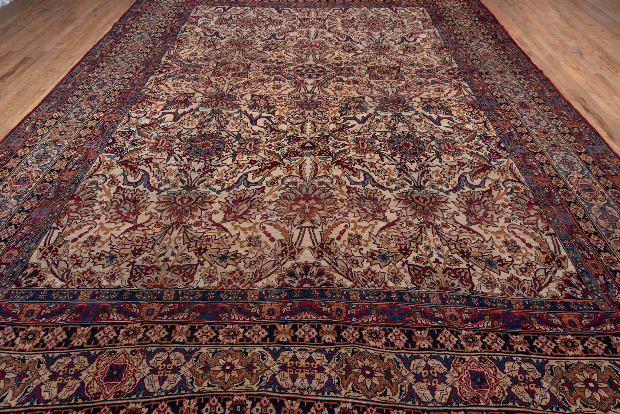 11' x 15' one-of-a-kind handmade antique Lavar oversize rug. Color palette: ivory, indigo, rust, burgundy, camel, navy, rose