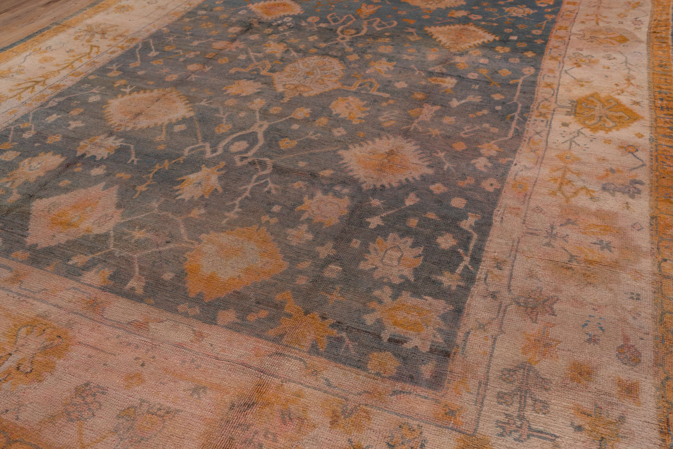 11' x 14' one-of-a-kind handmade antique Oushak oversize rug. Color palette: ivory, slate, gold, peach, taupe, saffron