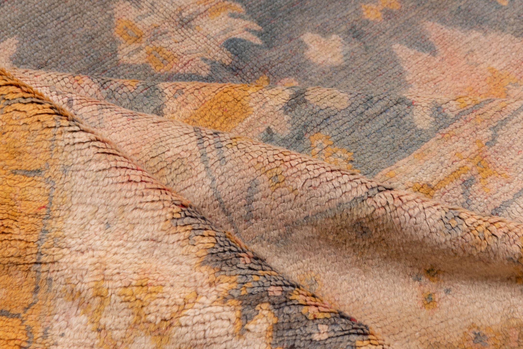 11' x 14' one-of-a-kind handmade antique Oushak oversize rug. Color palette: ivory, slate, gold, peach, taupe, saffron