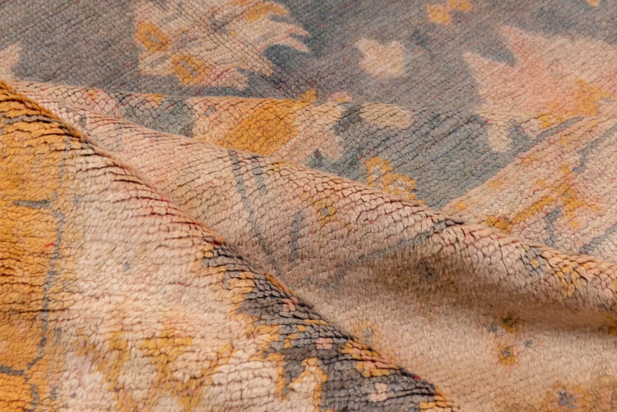 11' x 14' one-of-a-kind handmade antique Oushak oversize rug. Color palette: ivory, slate, gold, peach, taupe, saffron