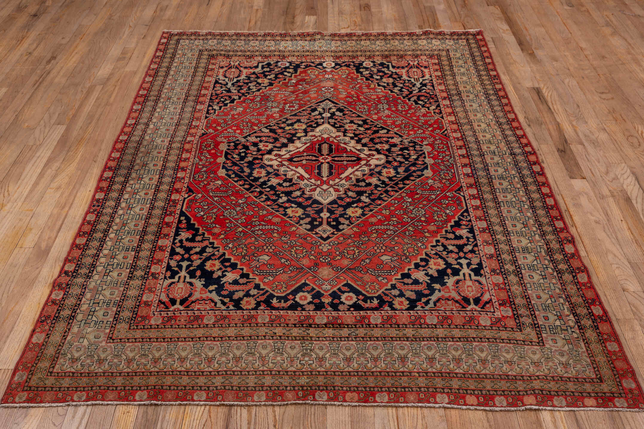 5' x 7' one-of-a-kind handmade antique Senne rug. Color palette: brick red, navy, ivory, rust, camel, charcoal, rose, taupe