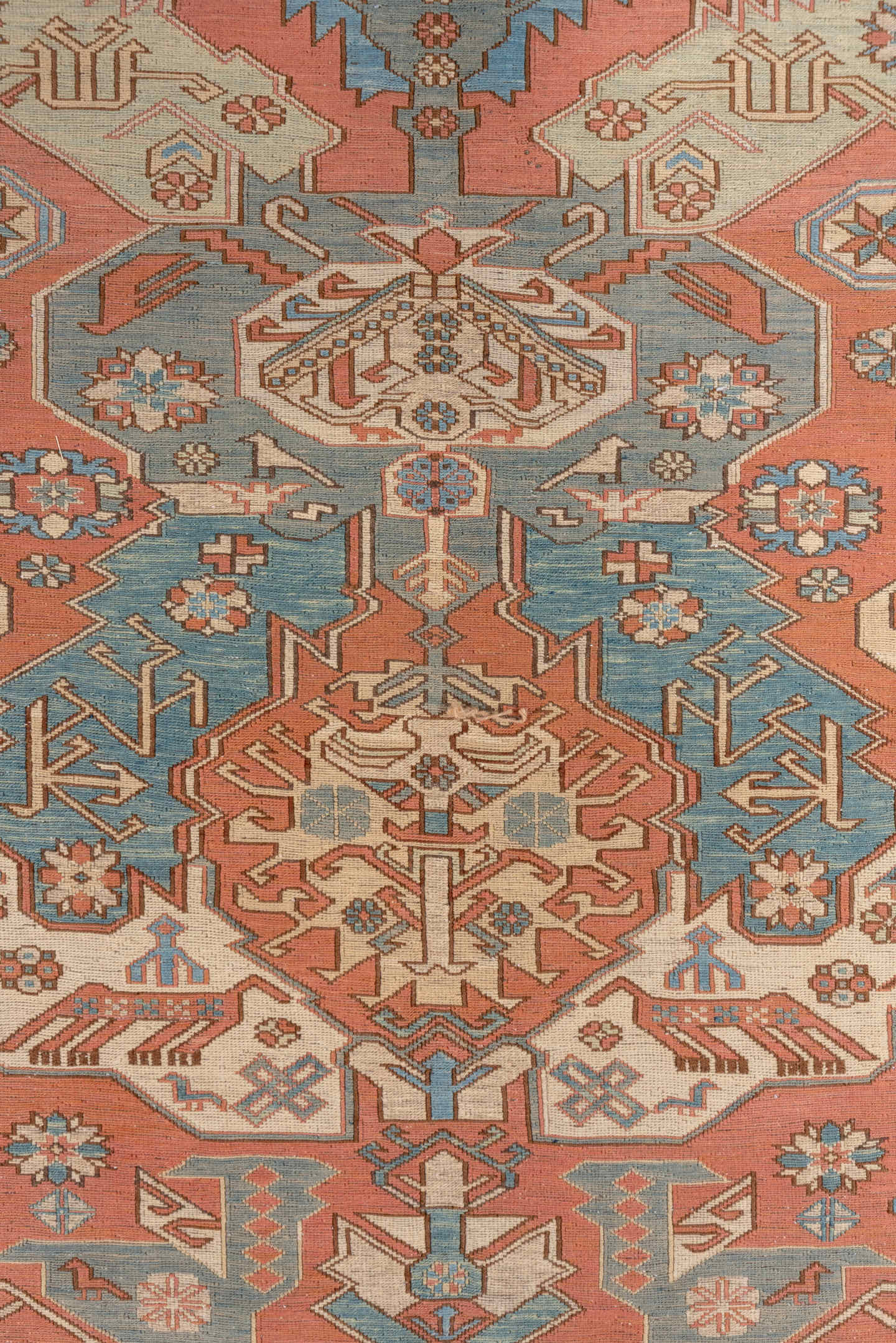 7' x 9' one-of-a-kind handmade vintage Sumak rug. Color palette: salmon, ivory, dusty blue, taupe, rust, beige, pink, blue