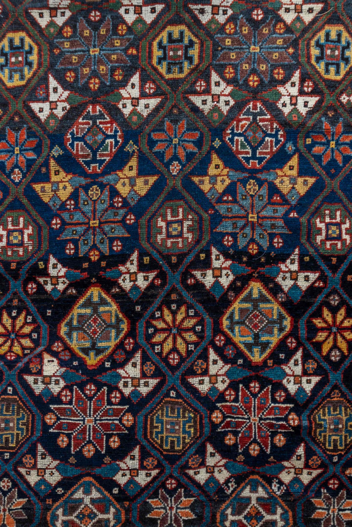 5' x 11' one-of-a-kind handmade vintage Baktiary rug. Color palette: navy, rust, ivory, indigo, gold, terra cotta, brown