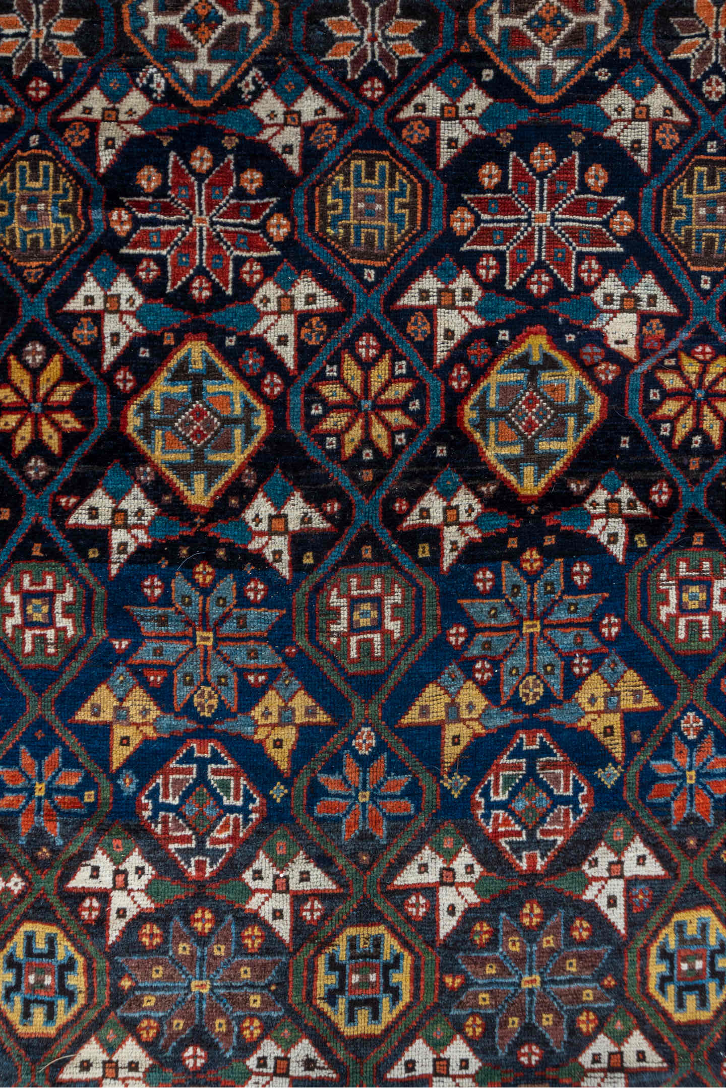 5' x 11' one-of-a-kind handmade vintage Baktiary rug. Color palette: navy, rust, ivory, indigo, gold, terra cotta, brown