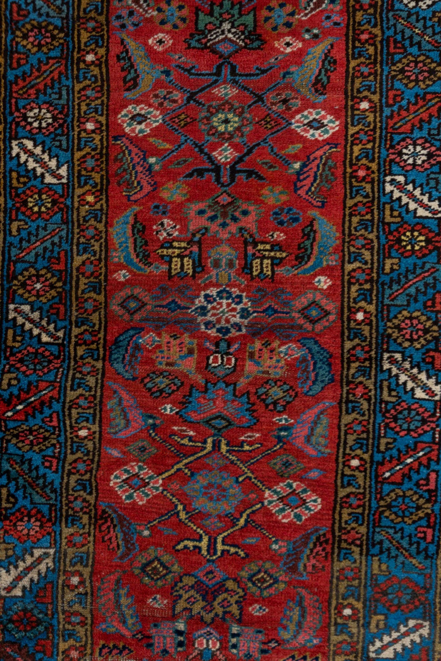 2' x 13' one-of-a-kind handmade vintage Heriz runner rug. Color palette: red, blue, navy, ivory, rust, gold, charcoal