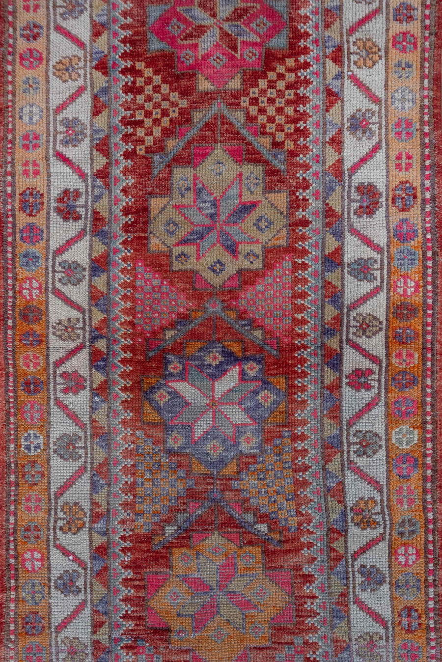 2' x 11' one-of-a-kind handmade vintage Oushak runner rug. Color palette: red, ivory, blue, pink, gold, rust, lavender