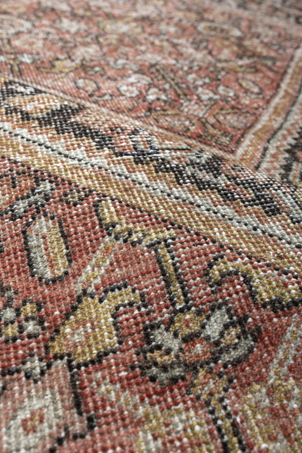 4' x 6' one-of-a-kind handmade vintage Mahal small size rug. Color palette: terra cotta, charcoal, ivory, rose, gold, taupe