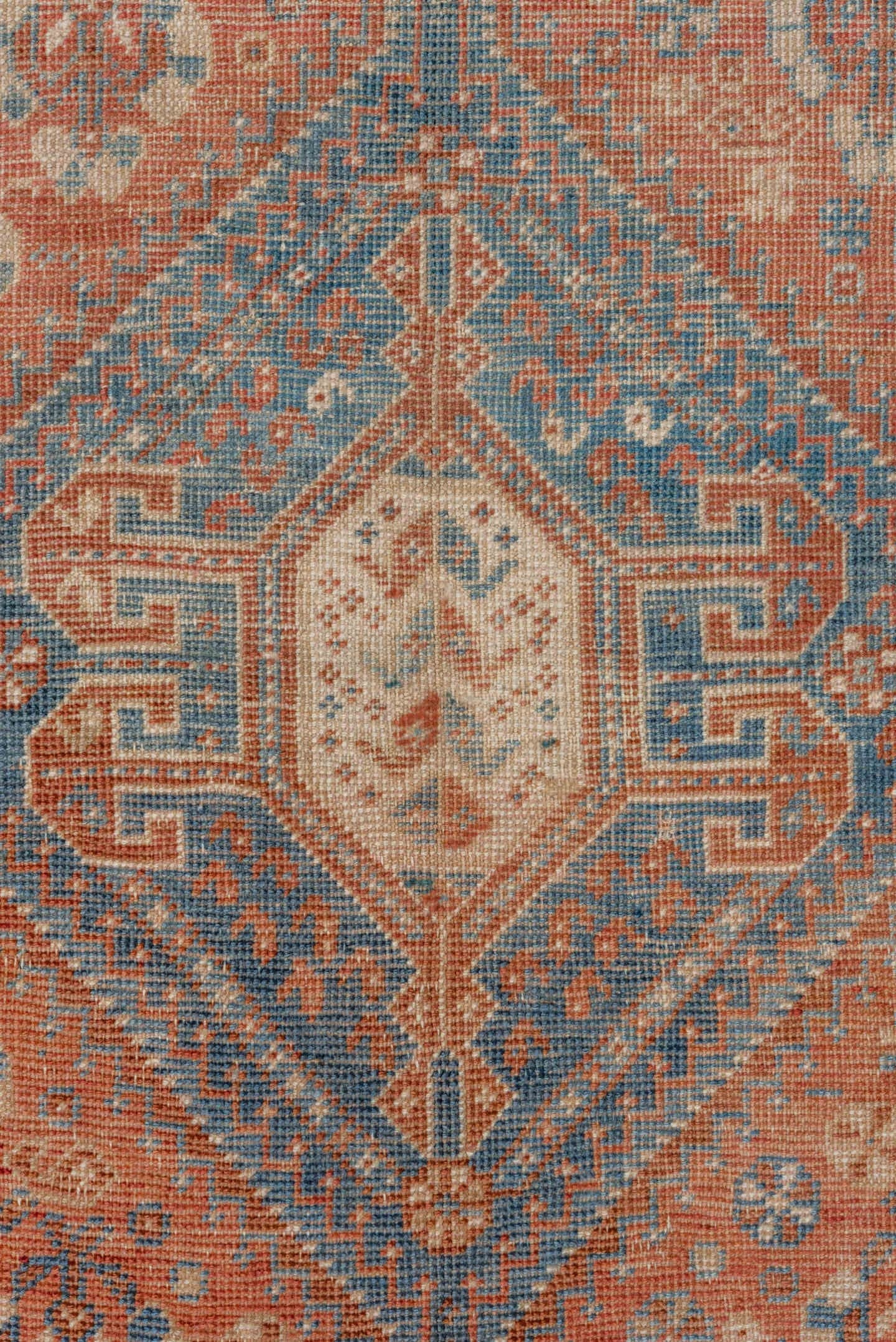 7' x 9' one-of-a-kind handmade vintage Shiraz rug. Color palette: terra cotta, ivory, sky blue, rust, beige, slate
