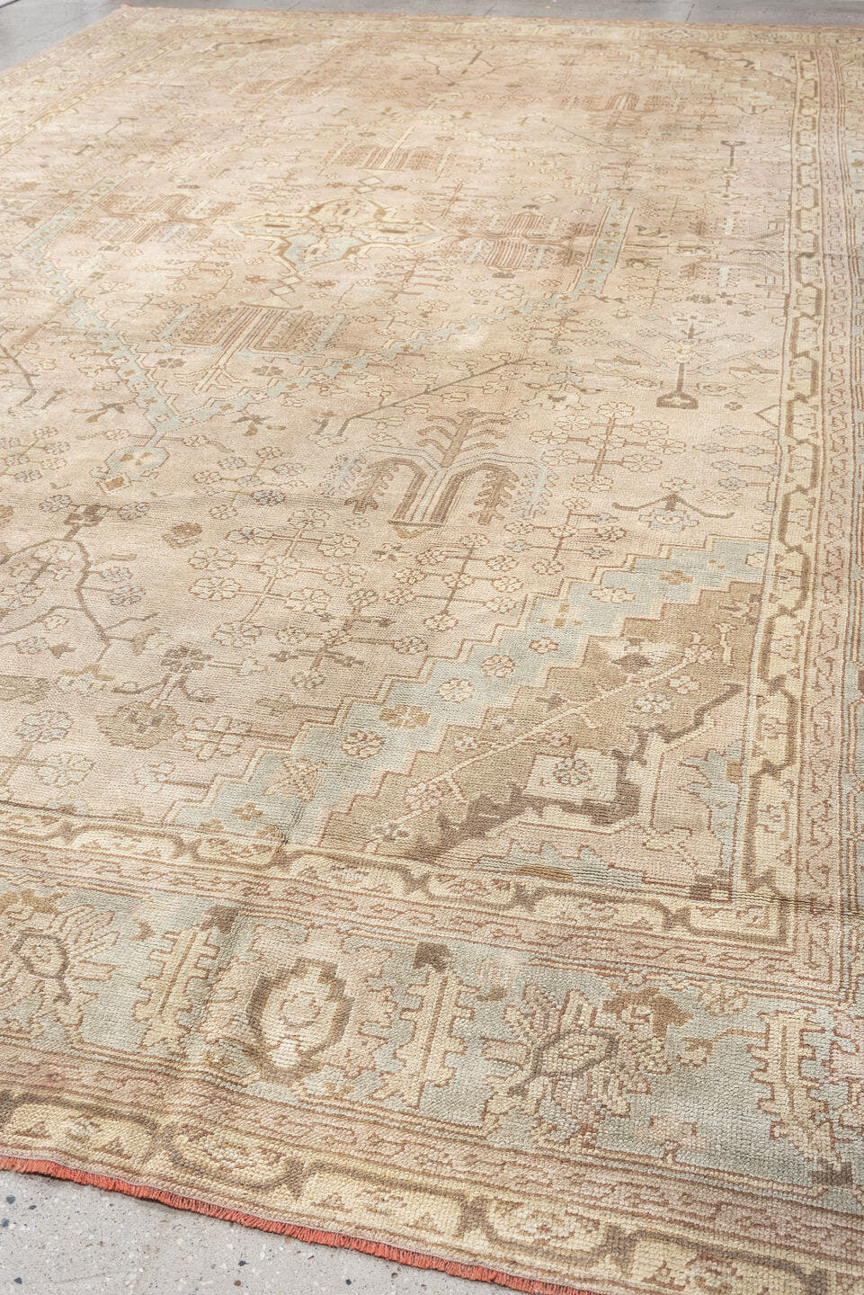 12' x 18' one-of-a-kind handmade antique Oushak oversize rug. Color palette: ivory, taupe, pale blue, faded terracotta