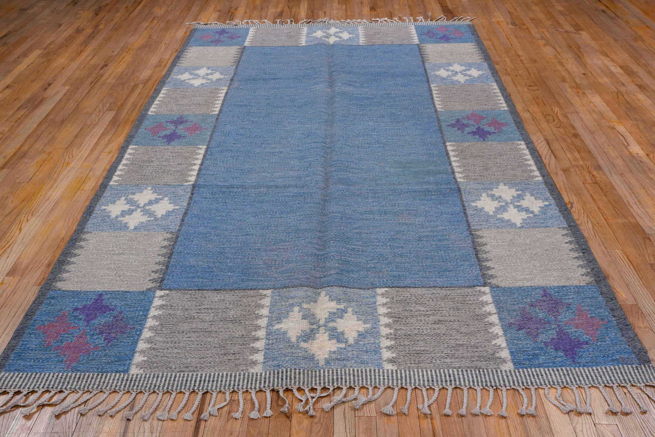 6' x 9' one-of-a-kind handmade vintage Rollaken medium size rug. Color palette: blue, gray, light blue, light gray