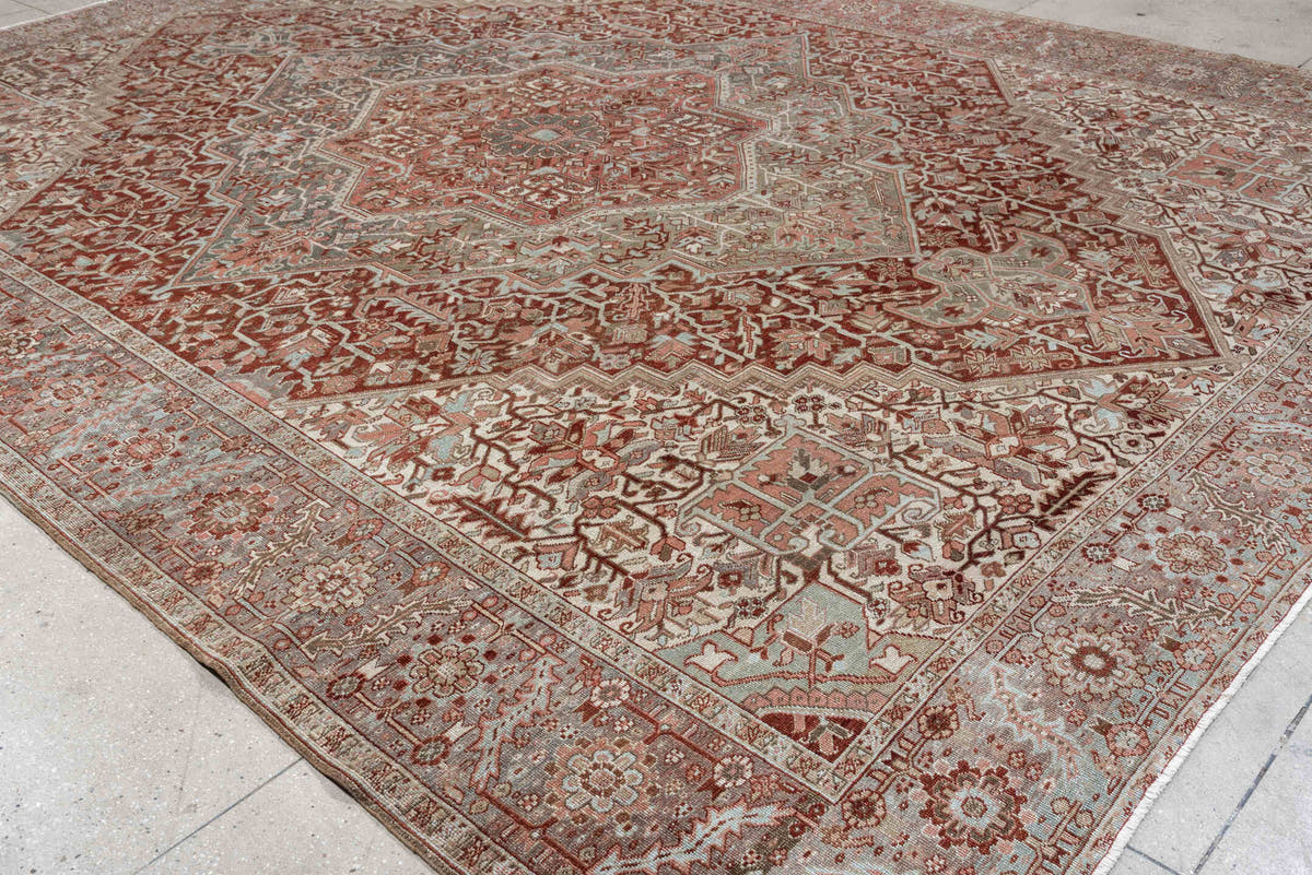 11' x 15' one-of-a-kind handmade antique Heriz oversize rug. Color palette: rust, ivory, sage, slate blue, dusty rose, taupe