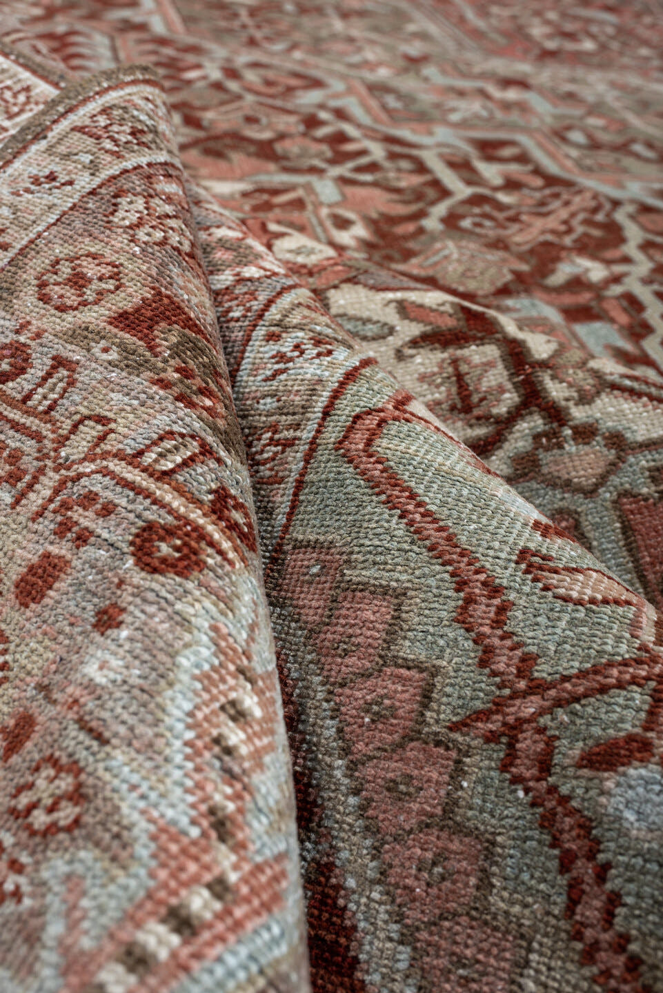 11' x 15' one-of-a-kind handmade antique Heriz oversize rug. Color palette: rust, ivory, sage, slate blue, dusty rose, taupe
