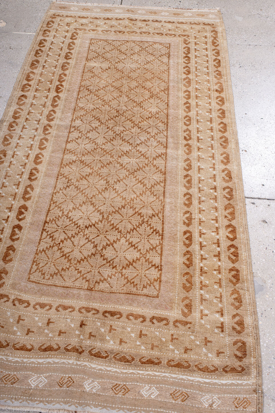 3' x 6' one-of-a-kind handmade vintage Belouch runner rug. Color palette: camel, beige, ivory, tan, taupe, gray