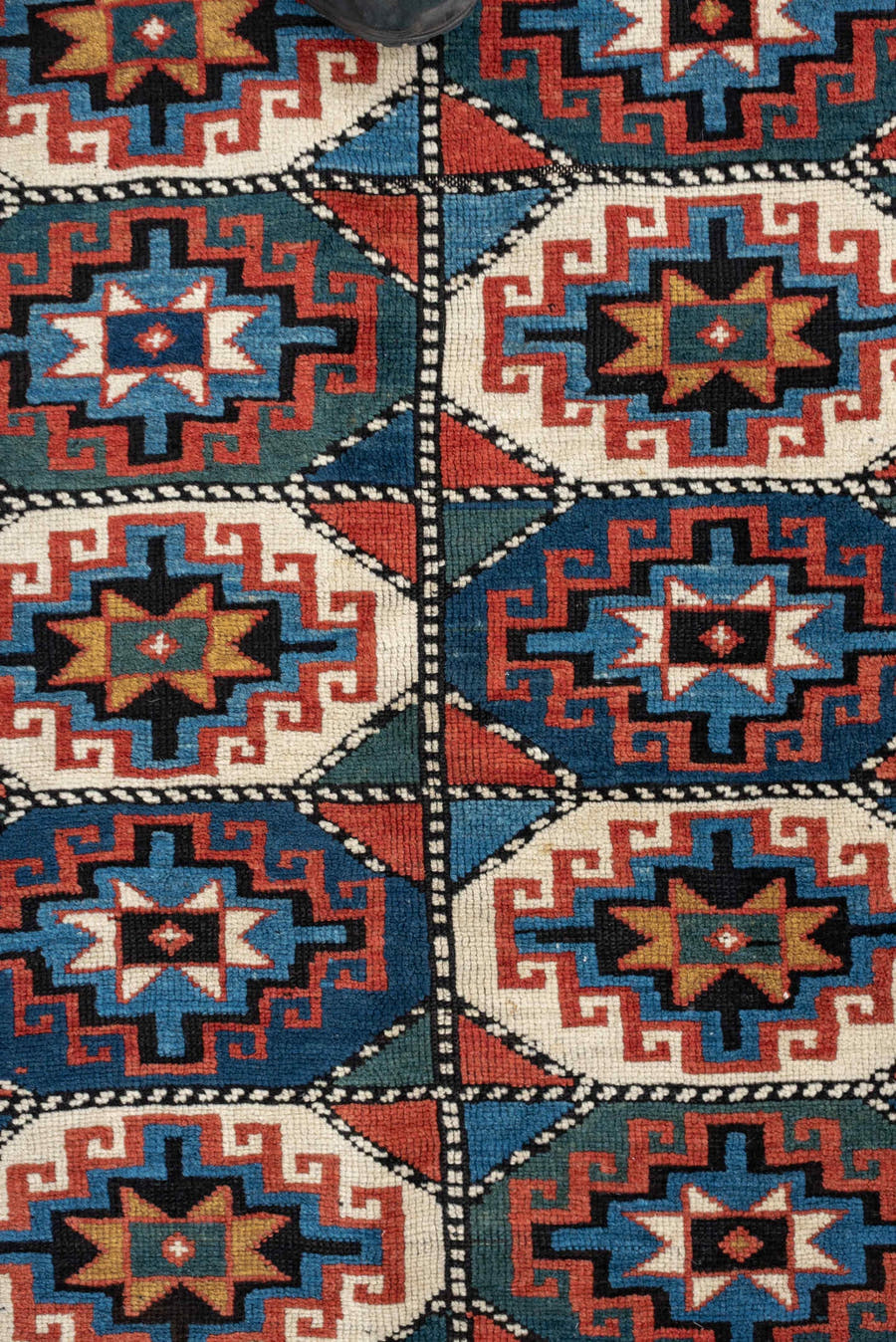 4' x 8' one-of-a-kind handmade vintage Kazak medium size rug. Color palette: teal, ivory, rust, navy, coral, charcoal, gold