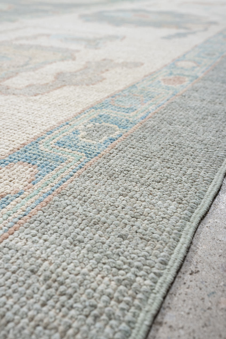 13' x 17' one-of-a-kind handmade vintage Oushak oversize rug. Color palette: pale blue, ivory, taupe, blush, cream, sky blue