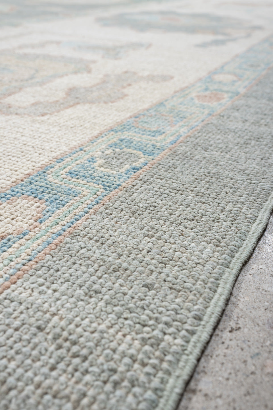 13' x 17' one-of-a-kind handmade vintage Oushak oversize rug. Color palette: pale blue, ivory, taupe, blush, cream, sky blue