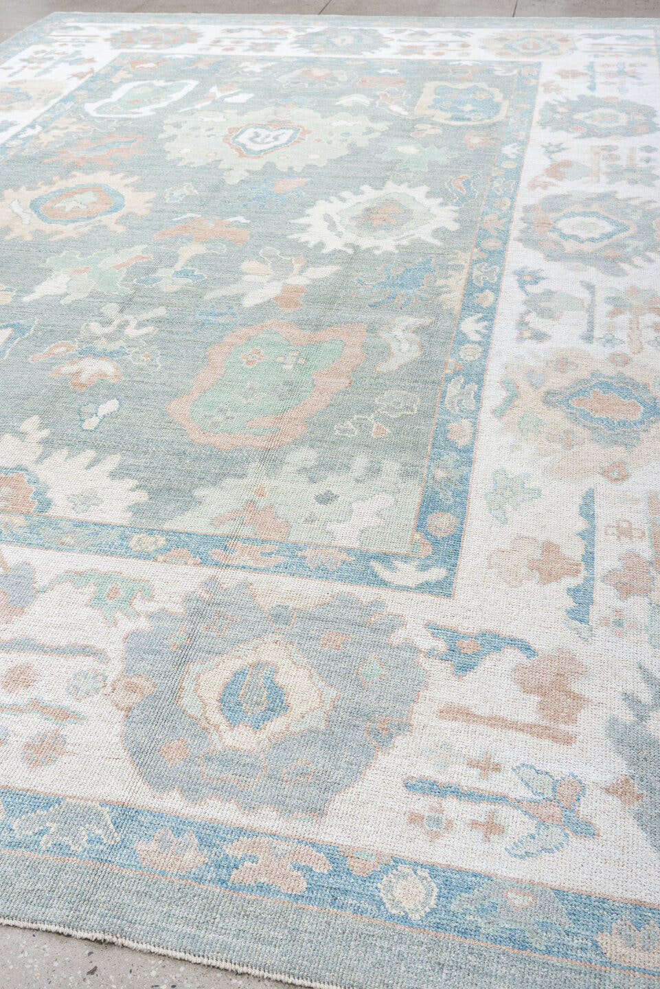 10' x 14' one-of-a-kind handmade vintage Oushak large size rug. Color palette: pale aqua, ivory, blush, sage, taupe, cream