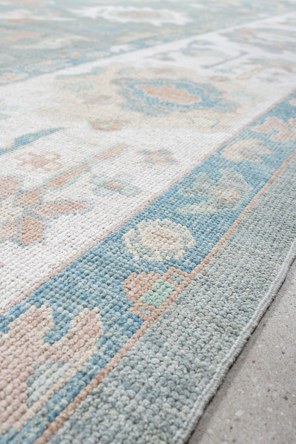 10' x 14' one-of-a-kind handmade vintage Oushak large size rug. Color palette: pale aqua, ivory, blush, sage, taupe, cream