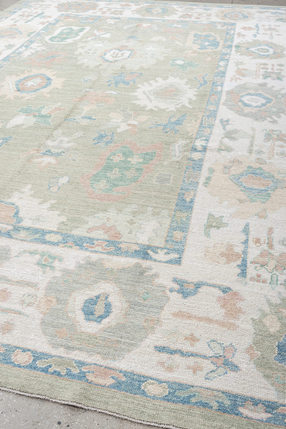 9' x 14' one-of-a-kind handmade vintage Oushak large size rug. Color palette: sage, ivory, sky blue, blush, taupe, cream
