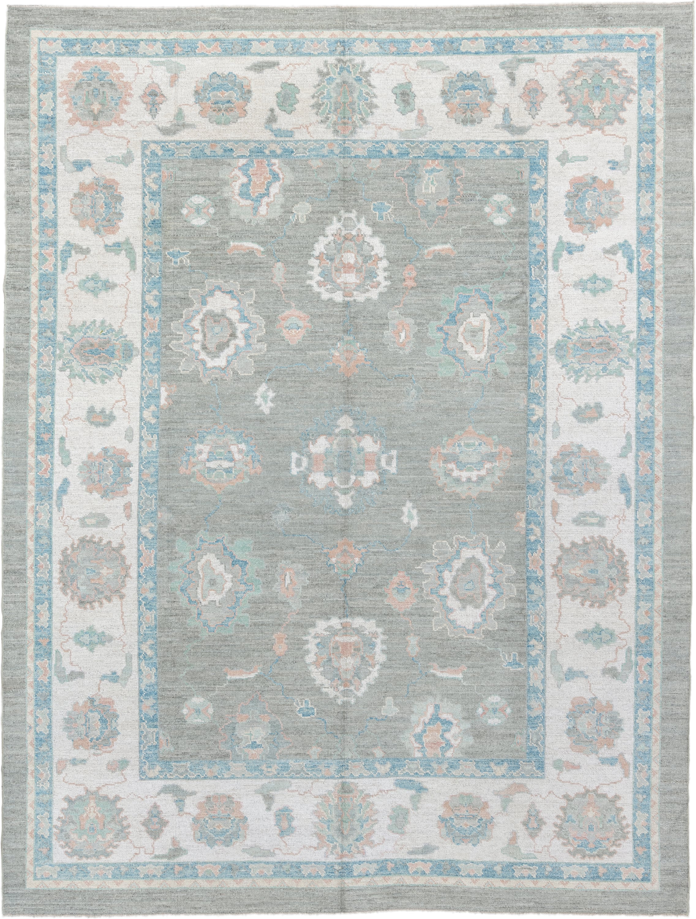 9' x 12' one-of-a-kind handmade vintage Oushak large size rug. Color palette: gray, ivory, sky blue, sage, blush, taupe